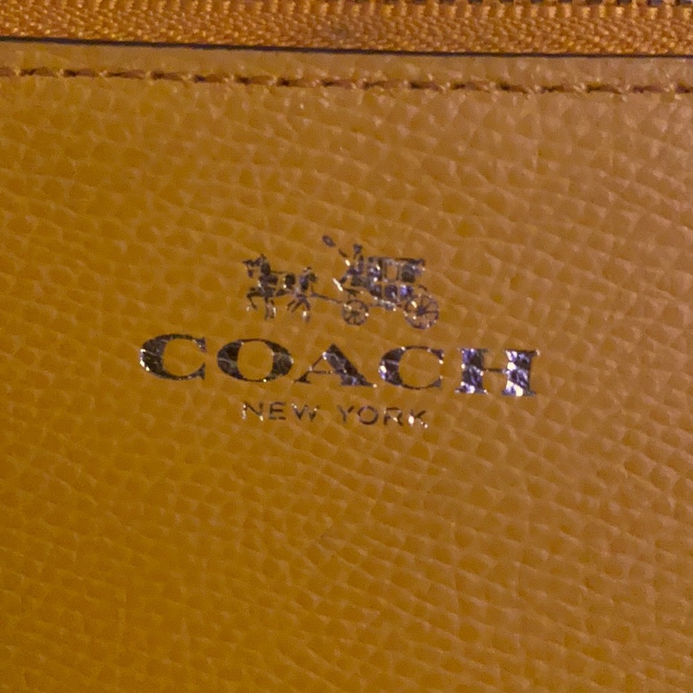 Orange coach coin purse